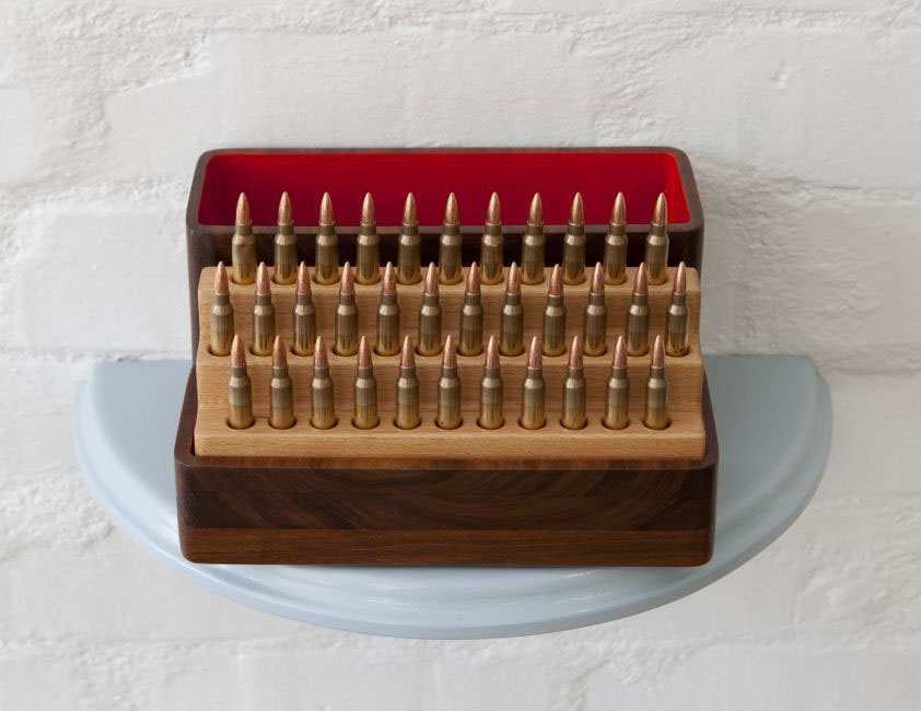 Click the image for a view of: Skerppunt Ammunisie (Sharp Point Ammunition) 2015 Remington .223 bullets (disarmed), Beech wood, Kiaat wood, wood, enamel paint 350X230X180mm